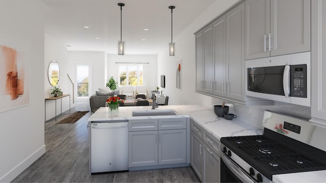 kitchen featuring white dishwasher, kitchen peninsula, gas stove, and gray cabinetry