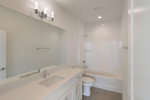 full bathroom with tiled shower / bath, vanity, toilet, and tile patterned flooring