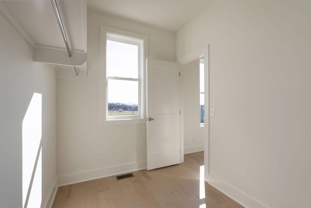 unfurnished room featuring light wood-type flooring