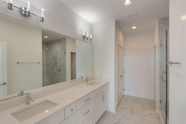 bathroom featuring vanity and a shower with shower door