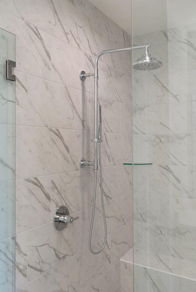 bathroom with tiled shower