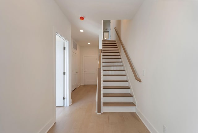 stairway featuring hardwood / wood-style floors