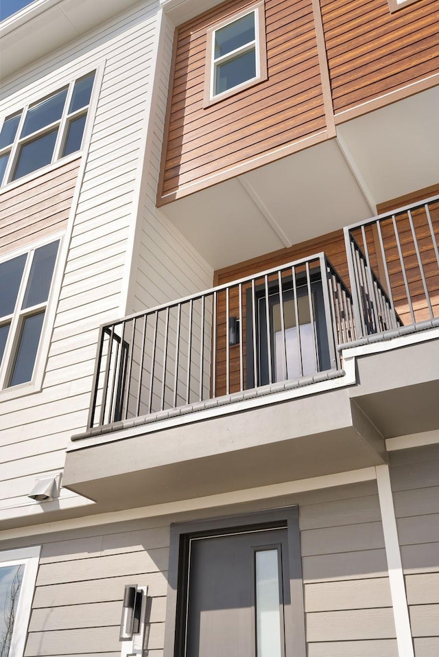 view of side of home with a balcony