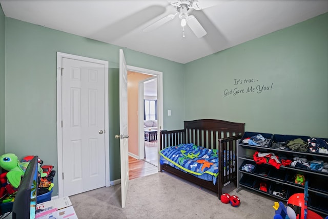 carpeted bedroom with ceiling fan