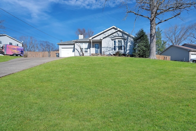 view of front of house featuring a garage and a front yard