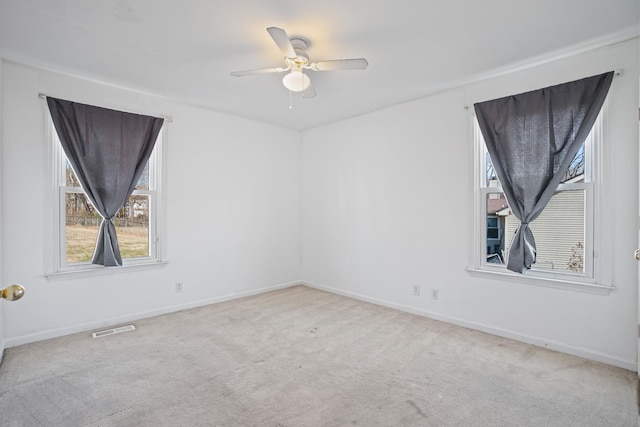 carpeted empty room with ceiling fan