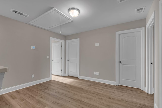 spare room featuring light hardwood / wood-style floors