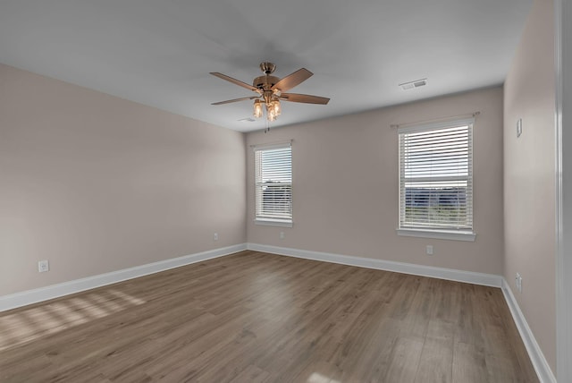 unfurnished room with ceiling fan and light hardwood / wood-style flooring