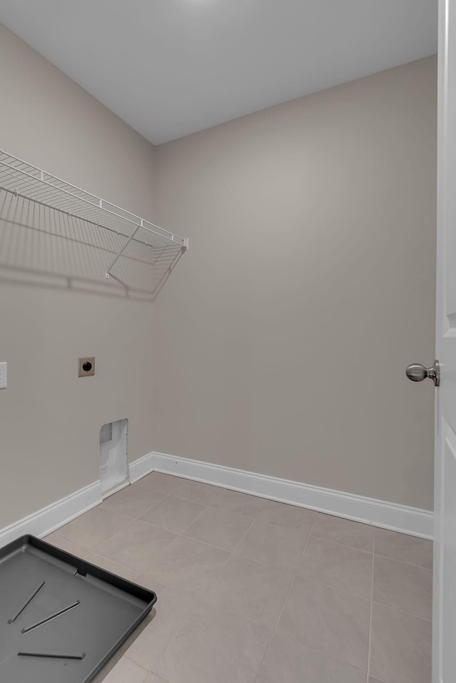 washroom with light tile patterned floors and electric dryer hookup