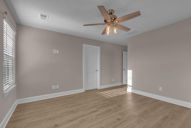 unfurnished room featuring ceiling fan and light wood-type flooring