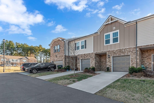 multi unit property featuring a garage