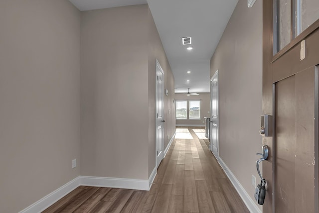 corridor featuring hardwood / wood-style floors