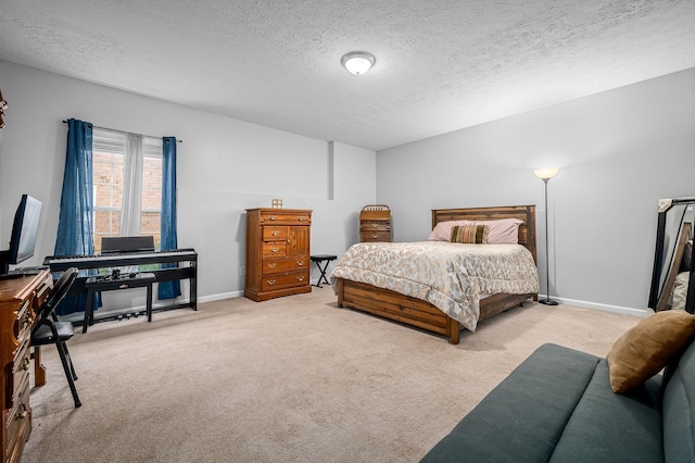 bedroom with light colored carpet and a textured ceiling