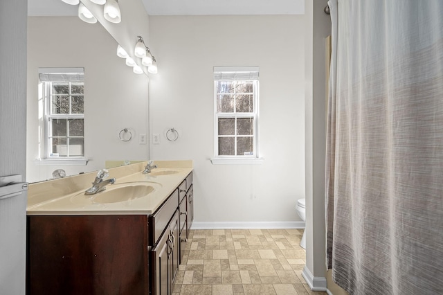 bathroom featuring vanity and toilet