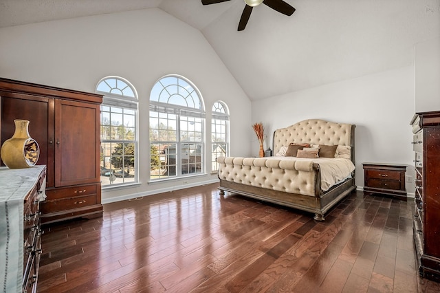 bedroom with dark wood-type flooring, high vaulted ceiling, and ceiling fan