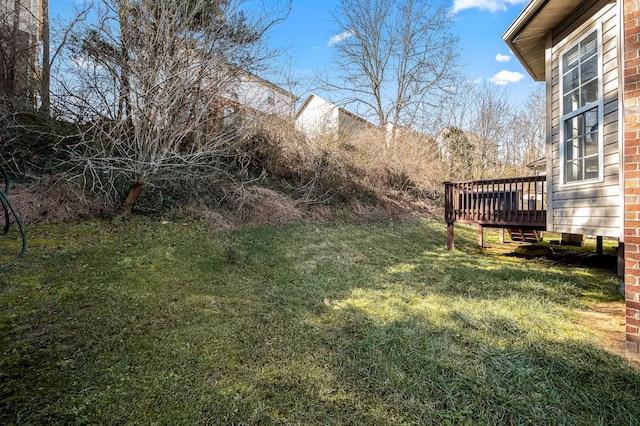 view of yard featuring a wooden deck