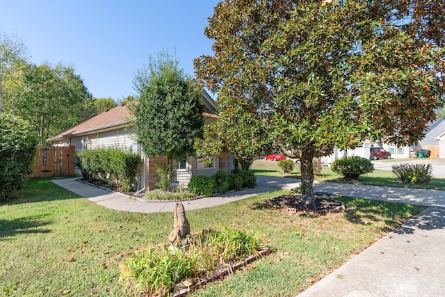 view of property exterior with a yard