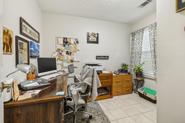 tiled office with a textured ceiling