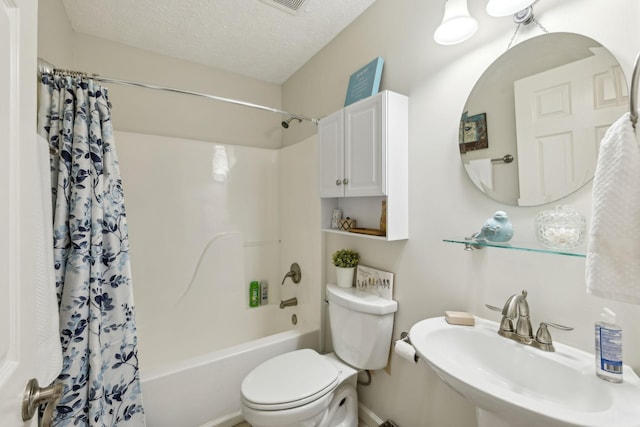 full bathroom with sink, shower / tub combo, a textured ceiling, and toilet