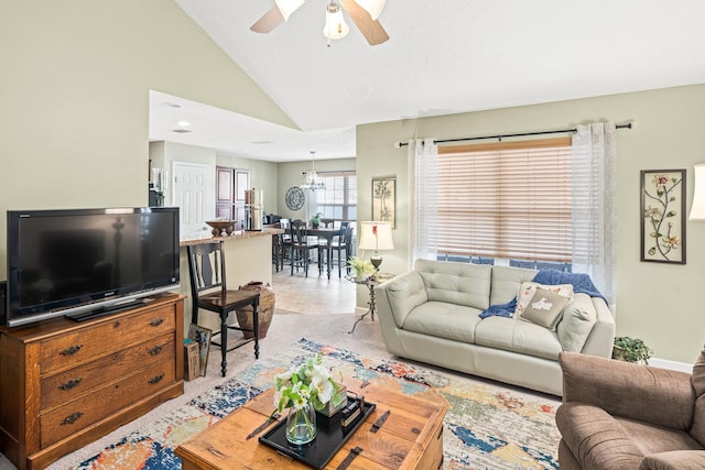 living room featuring ceiling fan and high vaulted ceiling