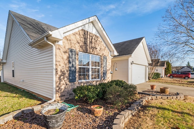 view of side of home featuring a garage