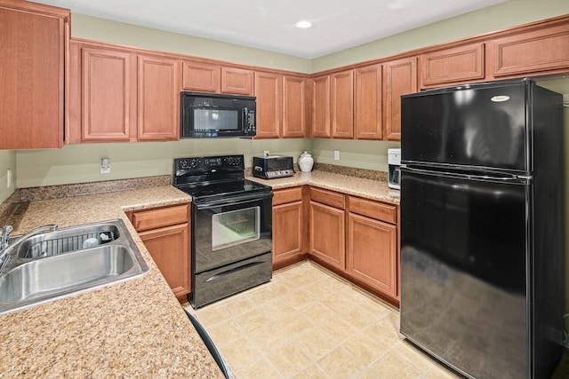 kitchen with sink and black appliances