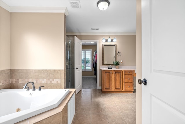 bathroom featuring ornamental molding, visible vents, a shower stall, and tile patterned floors