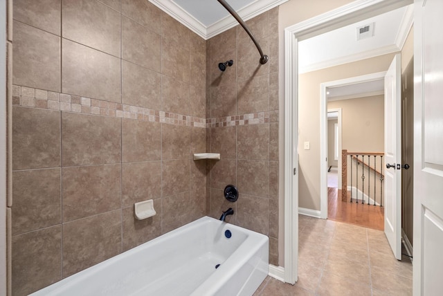 bathroom with visible vents, baseboards, tile patterned flooring, tub / shower combination, and crown molding