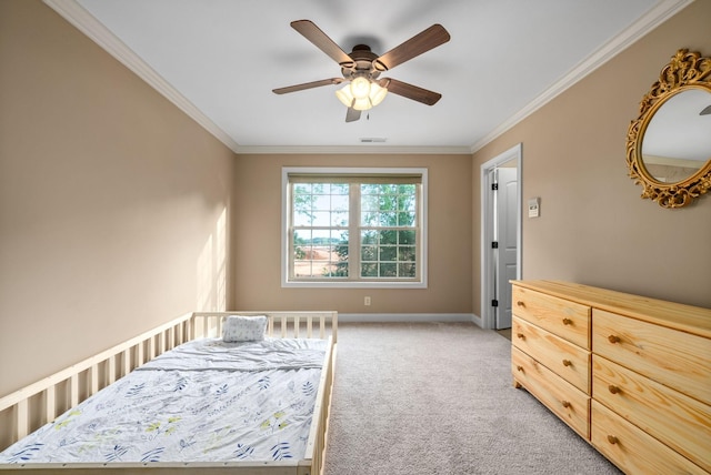 carpeted bedroom with crown molding and ceiling fan