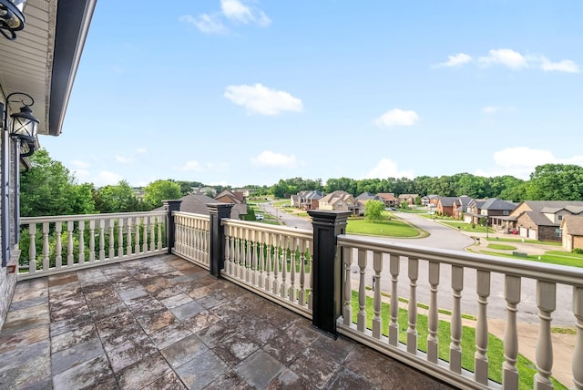 view of patio / terrace with a balcony and a residential view