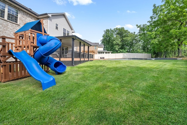 exterior space with a fenced backyard and a lawn