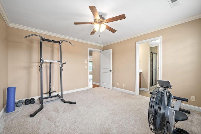 exercise room featuring crown molding, ceiling fan, and light carpet