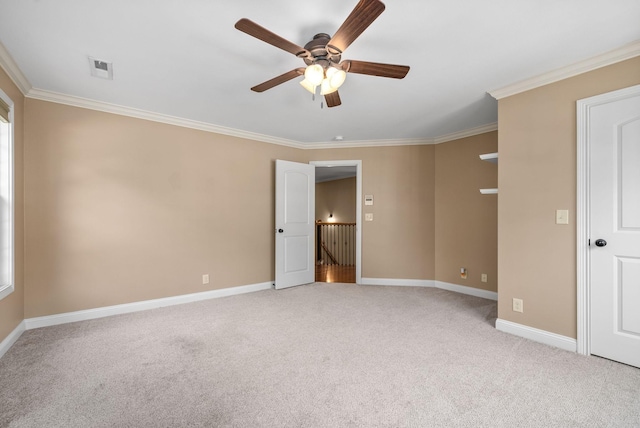 unfurnished bedroom featuring ceiling fan, ornamental molding, and light carpet