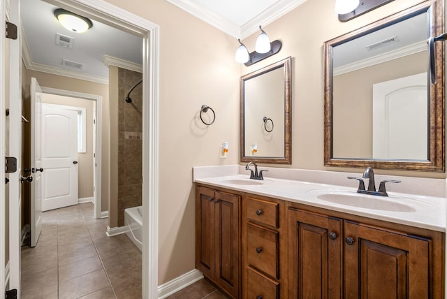 bathroom with crown molding, tile patterned floors, and vanity