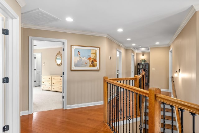 hallway with light wood-style floors, recessed lighting, baseboards, and an upstairs landing