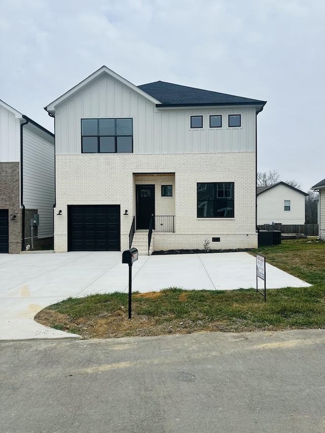 modern farmhouse style home featuring a garage