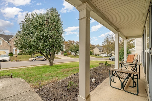 view of yard with covered porch