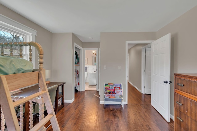 bedroom with dark hardwood / wood-style flooring