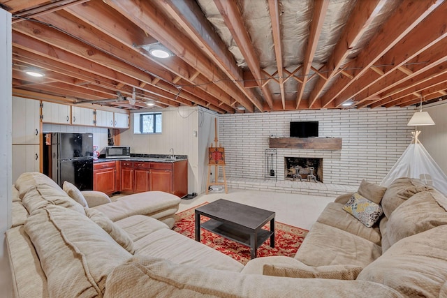 living room with sink and a brick fireplace