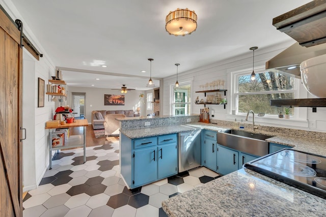 kitchen featuring blue cabinetry, sink, dishwasher, pendant lighting, and a barn door