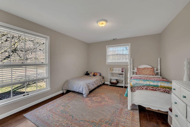 bedroom featuring dark hardwood / wood-style flooring