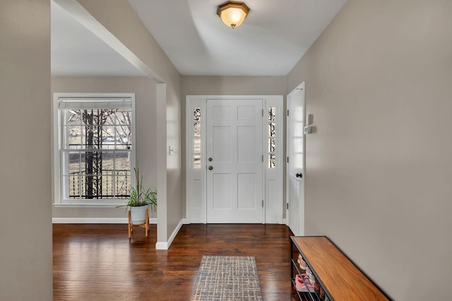 foyer with dark hardwood / wood-style flooring