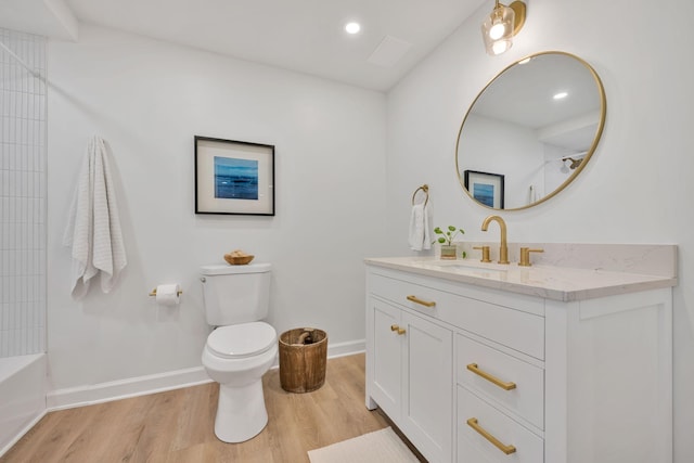 full bathroom featuring vanity, wood-type flooring, bathing tub / shower combination, and toilet