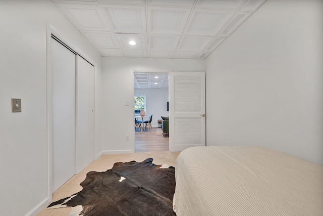 carpeted bedroom with a closet