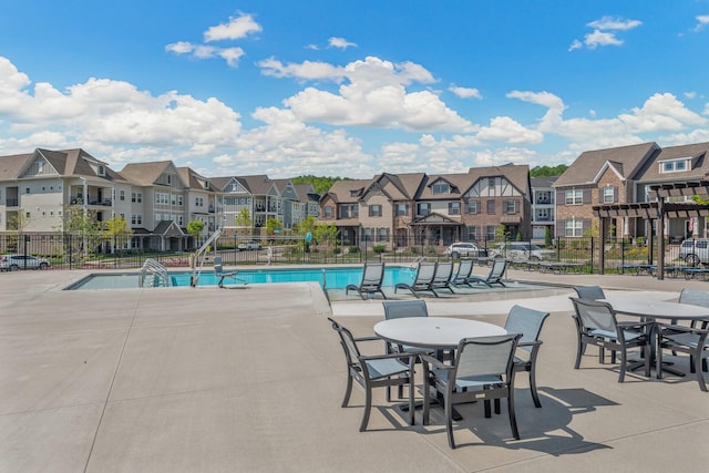 view of swimming pool with a patio area