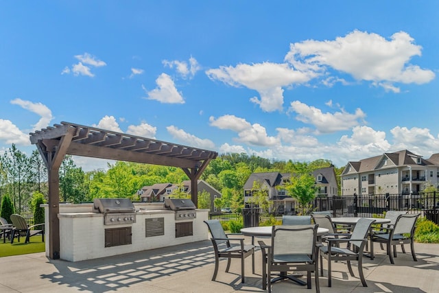 view of patio featuring area for grilling and a pergola