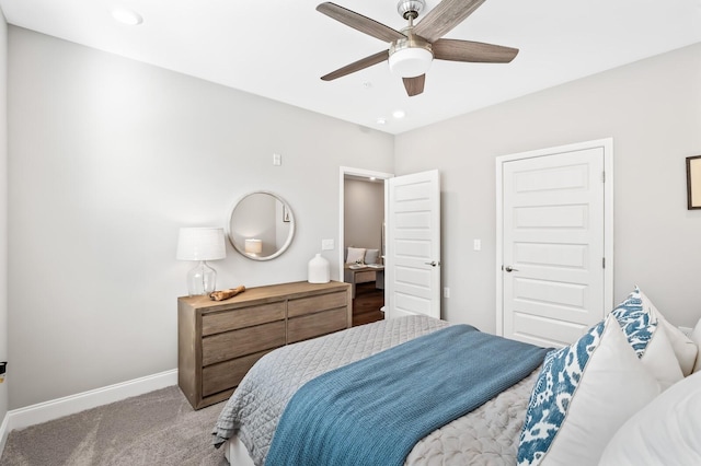 bedroom featuring light carpet and ceiling fan