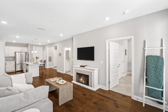 living room featuring dark wood-type flooring