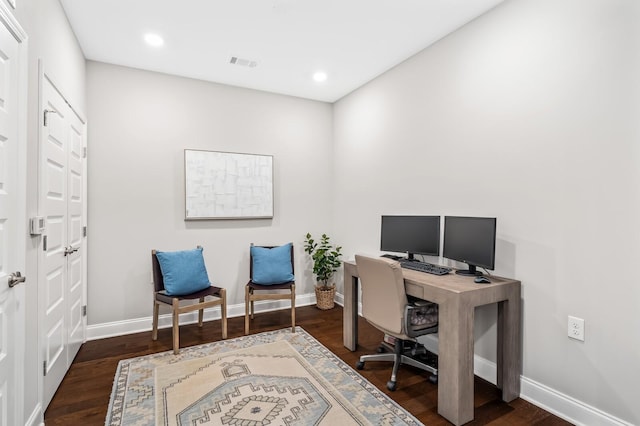 office with dark hardwood / wood-style flooring