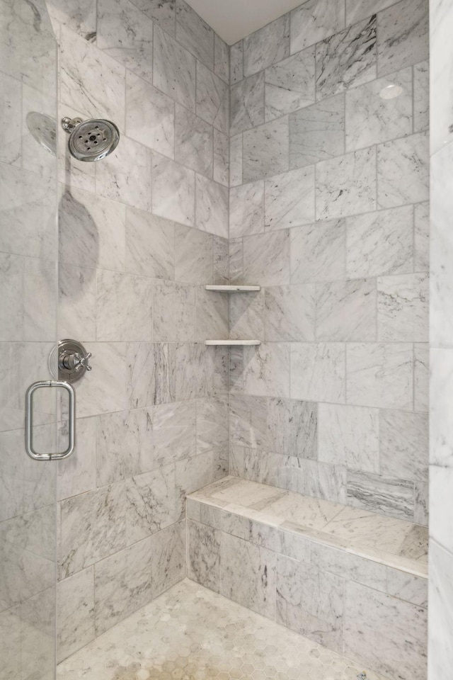 bathroom featuring an enclosed shower